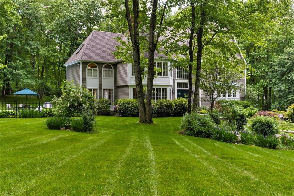 The home is set back from the road and adjacent to