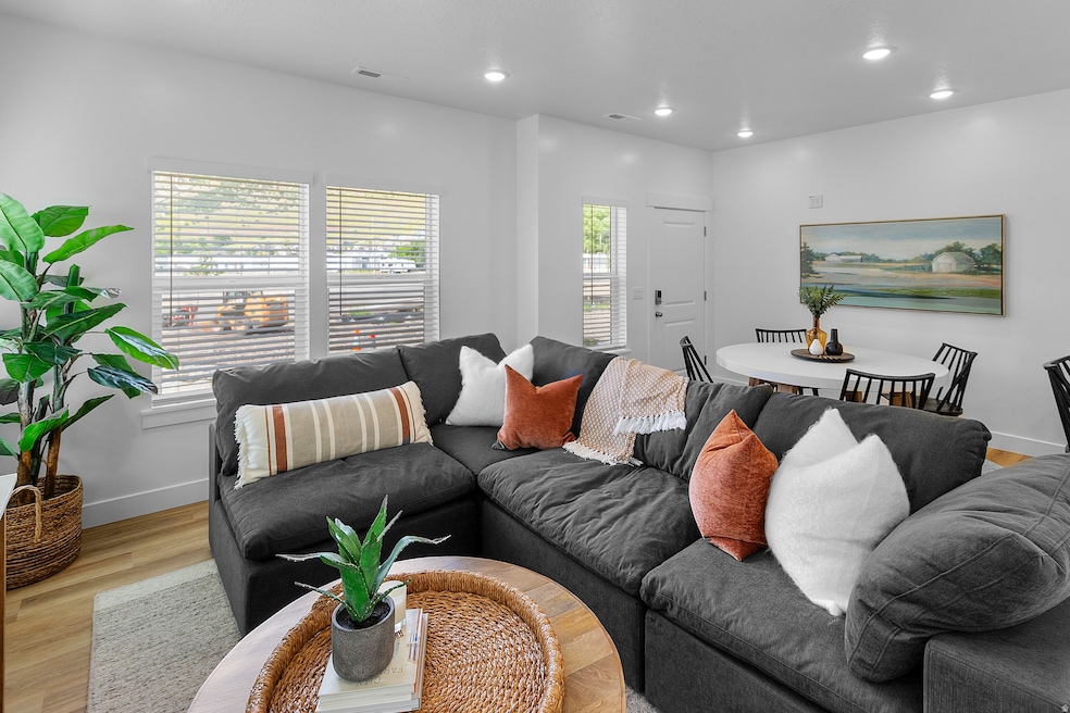 Living room featuring wood finished floors and recessed lighting