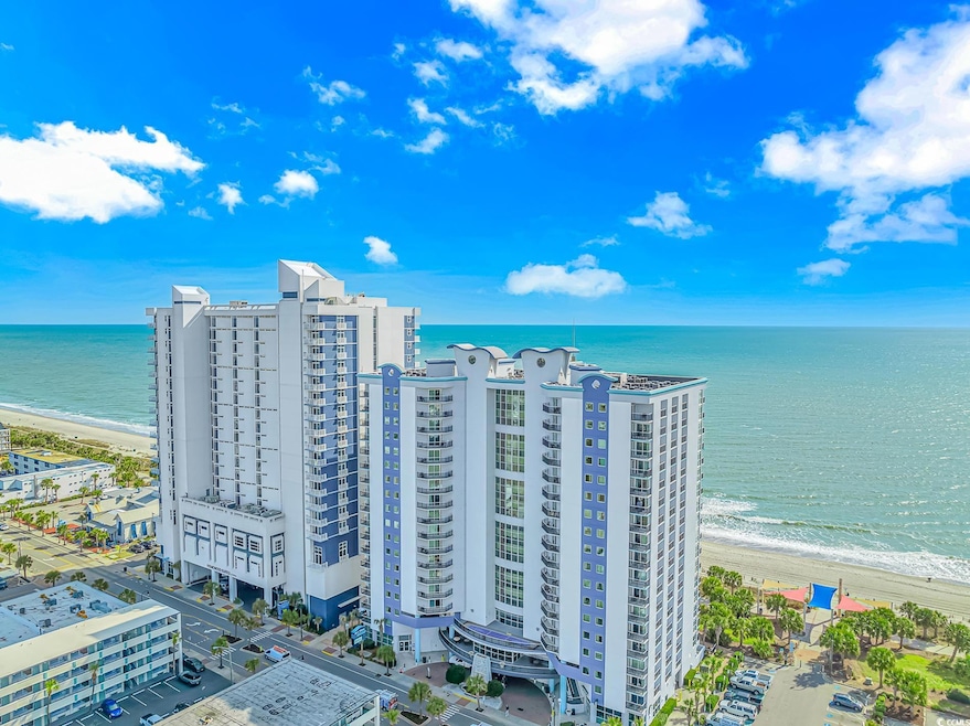 Drone / aerial view with a city view, a water view