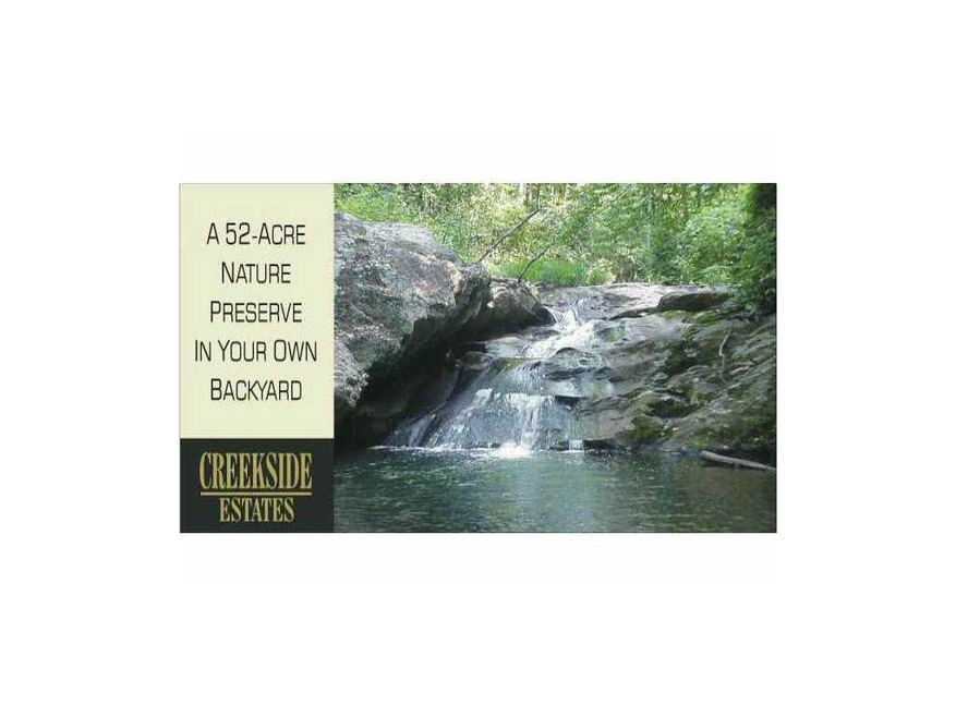 Land. Waterfall along walking trails in community.