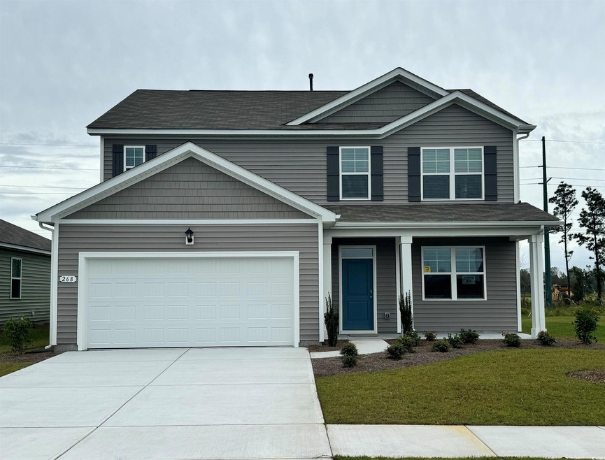 View of front of property featuring a front yard a