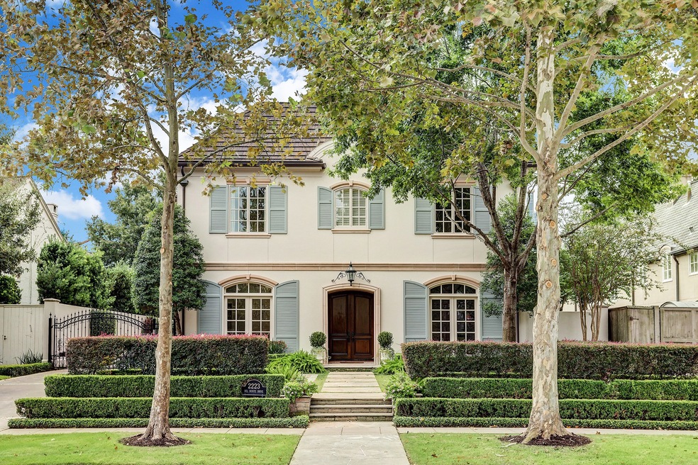 [Front Elevation]
This Regency-inspired home offers an impressive front facade surrounded by terraced gardens.