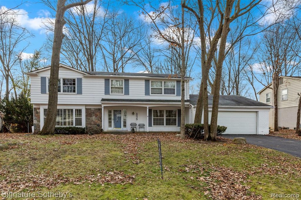 Lovely front elevation with covered porch and ston