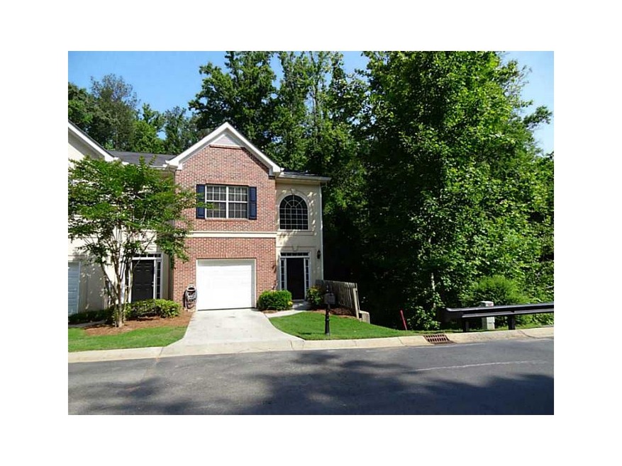 Exterior Front. Private end unit with creek to the
