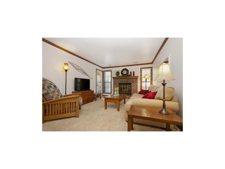 Spacious living room with newer carpet.