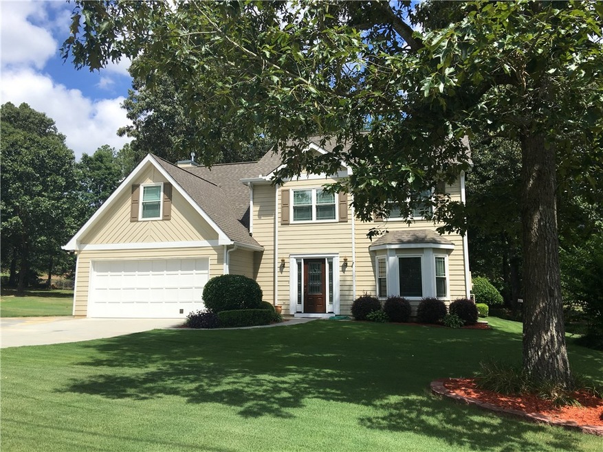 Beautifully landscaped yard with sprinkler system