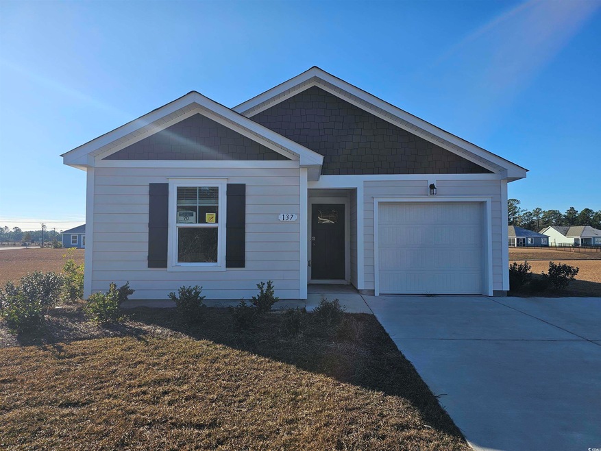 View of front of property featuring driveway and a
