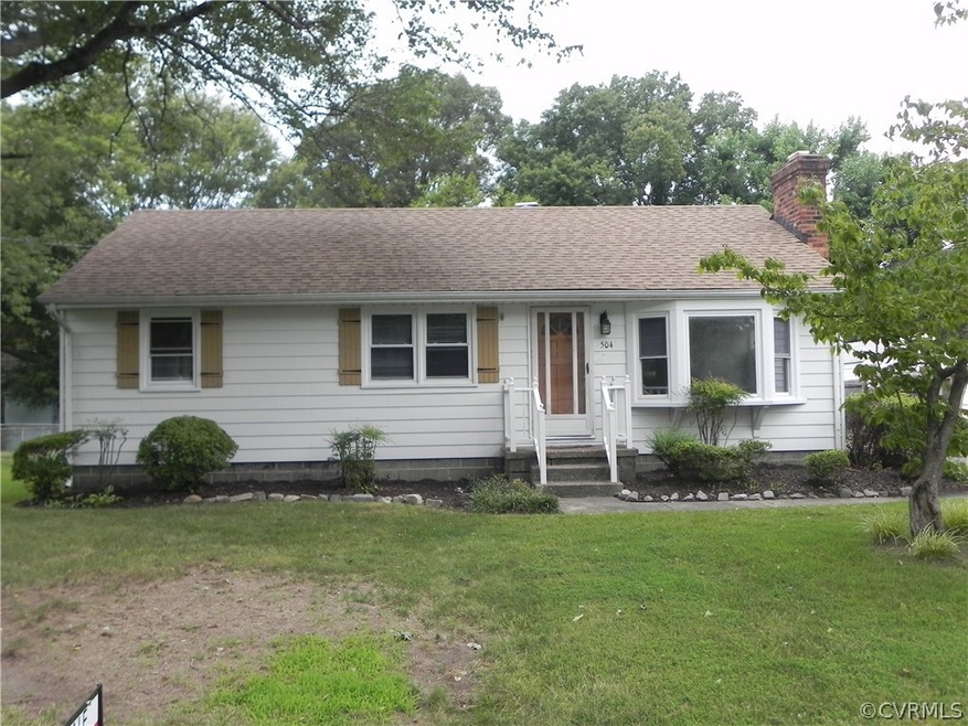 Single story home featuring a front lawn