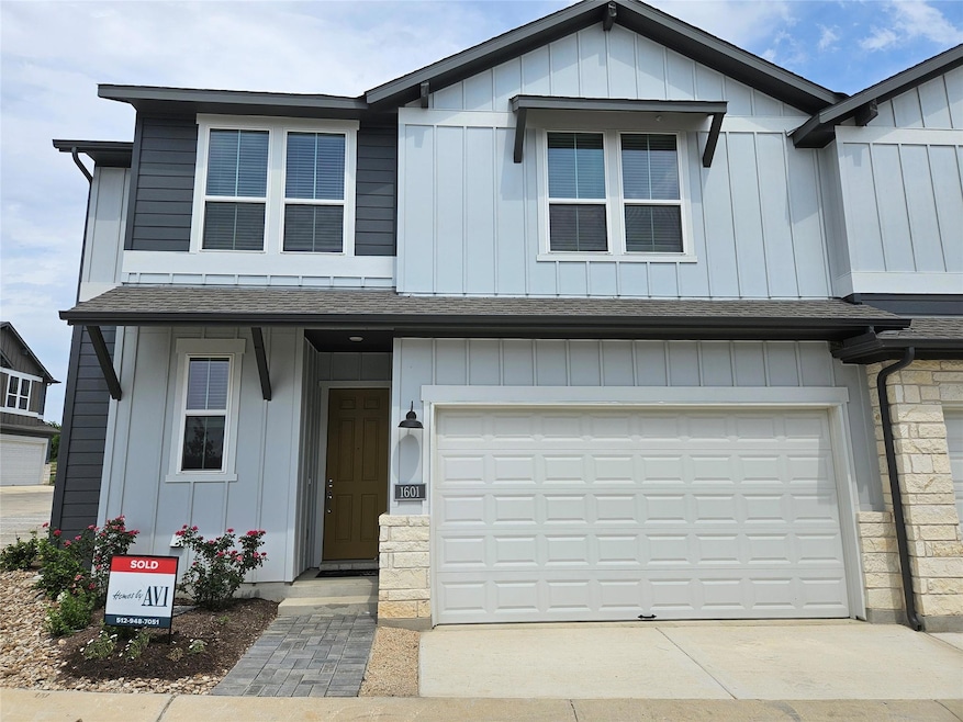 Multi unit property featuring a shingled roof, co