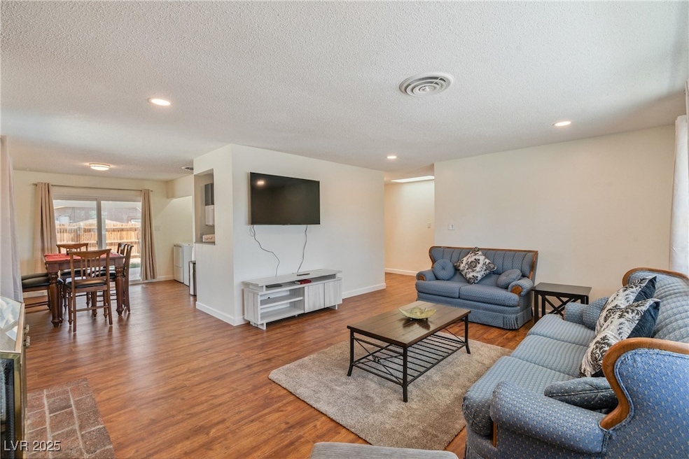 Living room featuring wood finished floors, recess