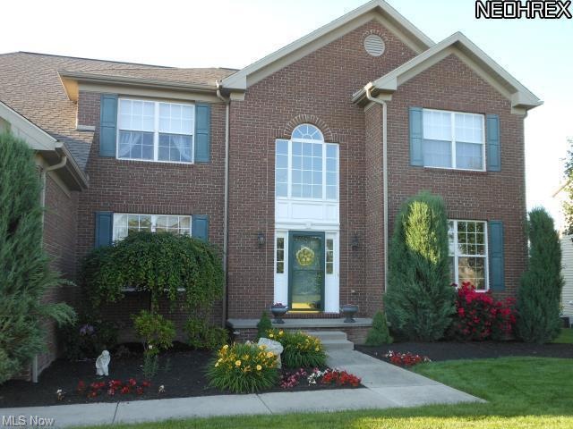 Beautifully landscaped, 4 bedroom center hall tran