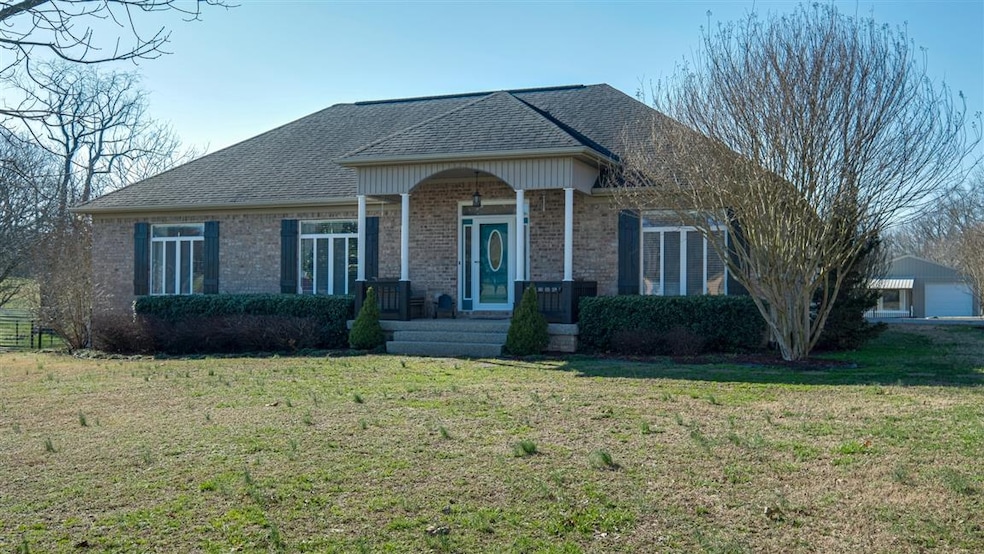 This inviting brick home sits perfectly on this large lot.