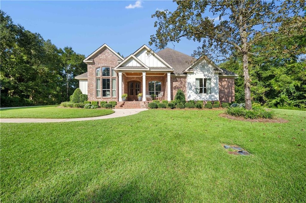 Craftsman inspired home featuring a front lawn
