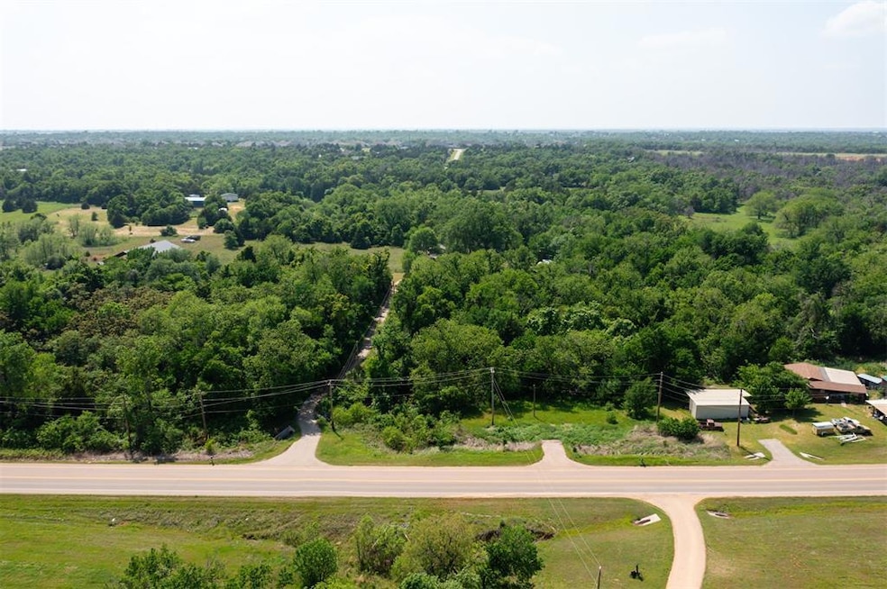 Long driveway into 14.27 acres and short driveway 