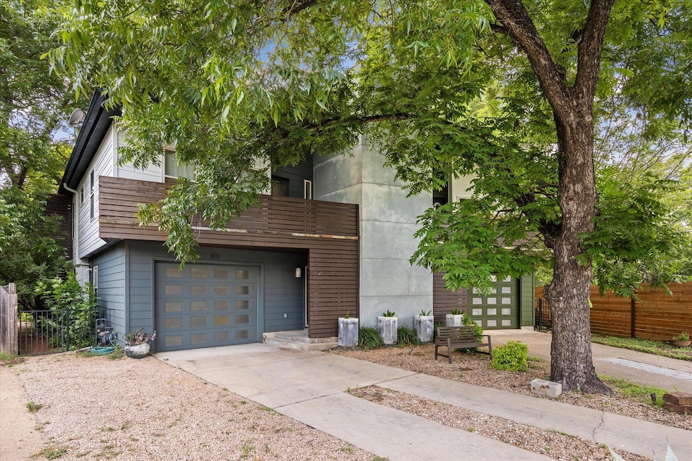 View of front of house with driveway, a garage, a