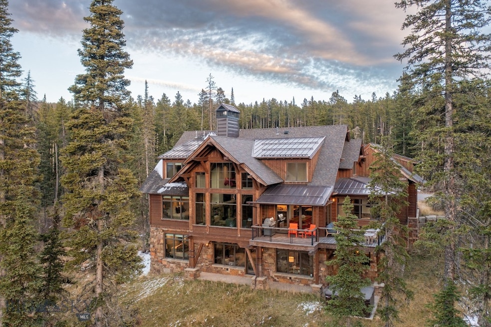Back house at dusk with a balcony