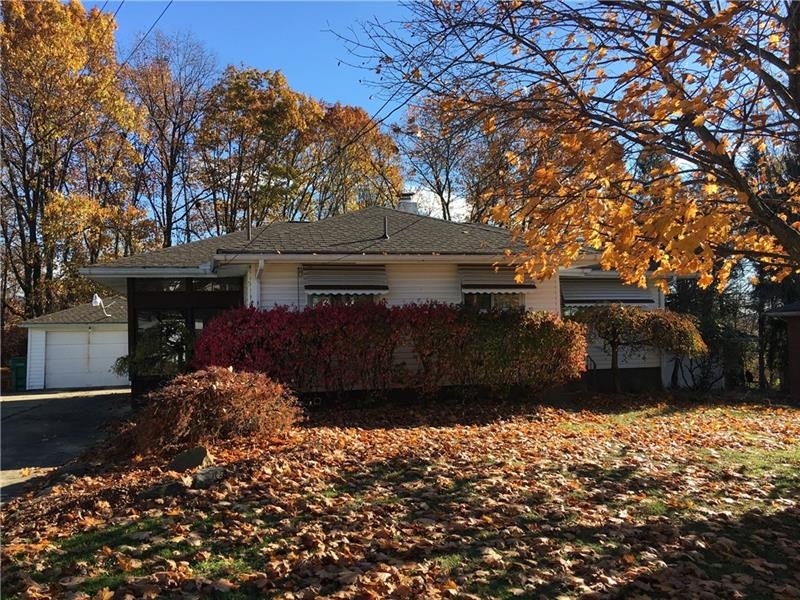 Charming ranch home offers a screened porch, vinyl