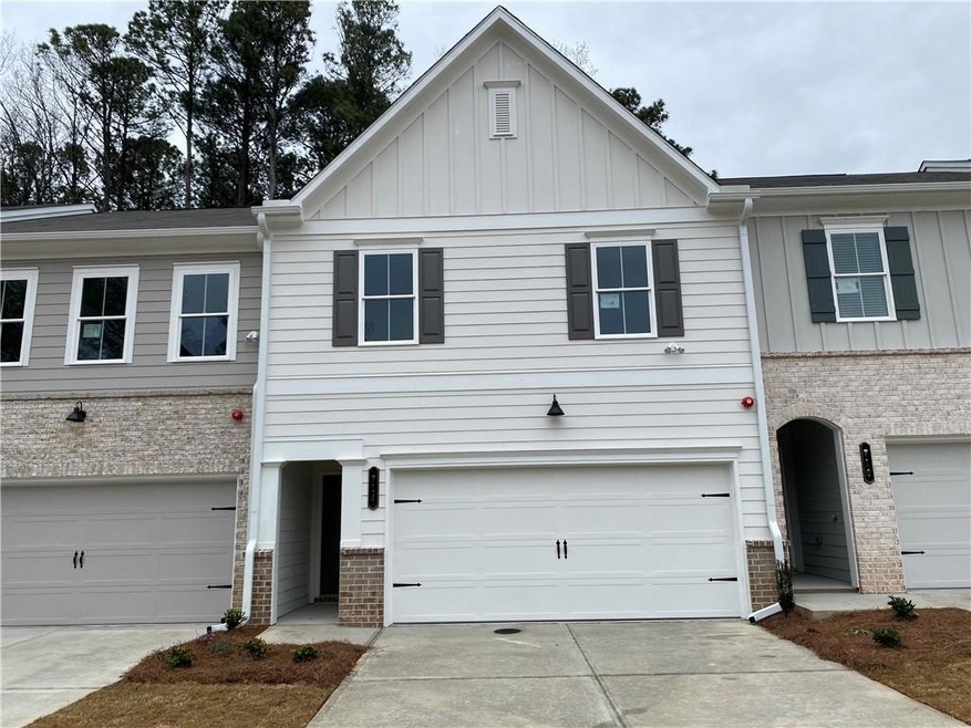 Townhome / multi-family property featuring a garag