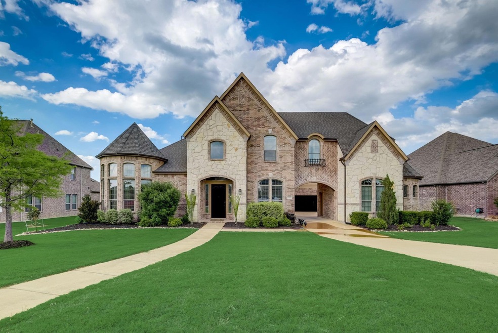French country home with a front yard