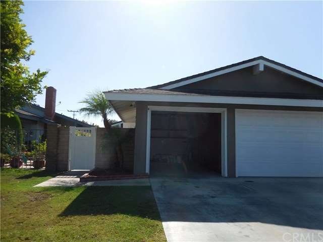 Front view of Unit B with single car garage door o
