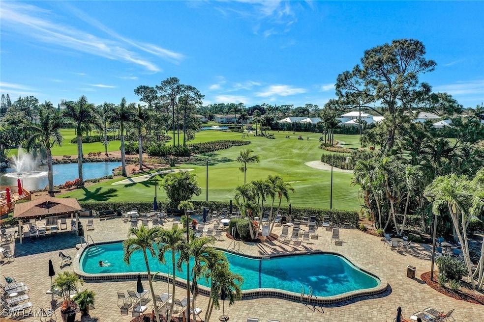 View of pool with a gazebo and a water view