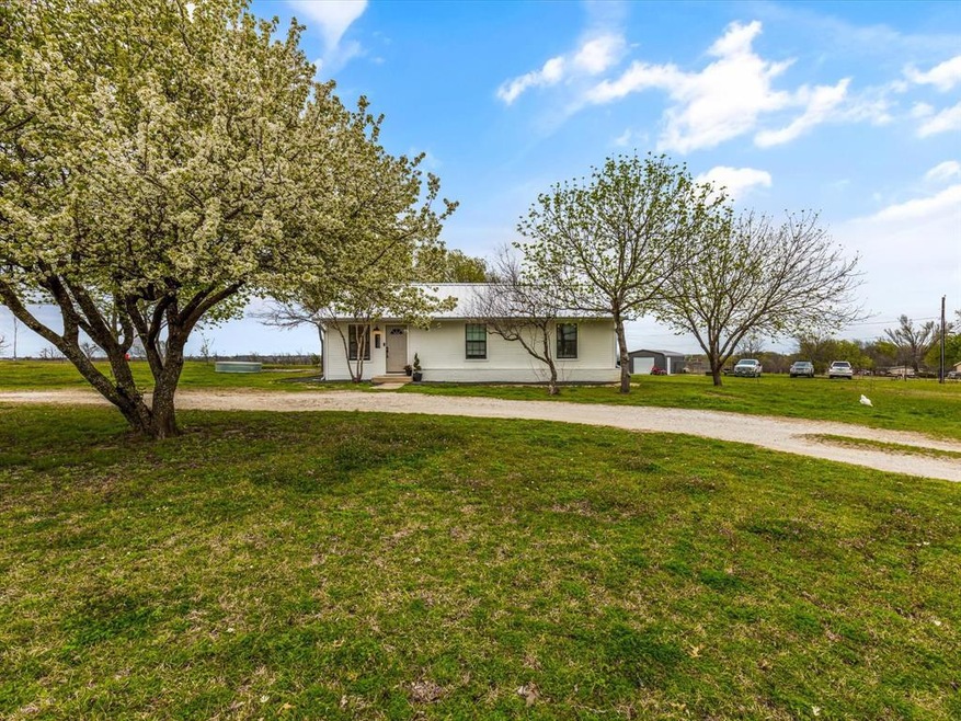 A little slice of Heaven in the country. The Bradford Pear is blooming beautifully in this photo!
