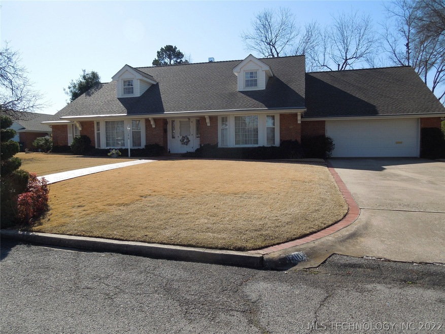 Street view of property.  House faces North
