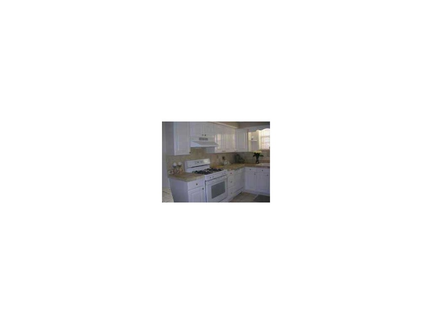 Exterior Front. Beautiful open kitchen with white 