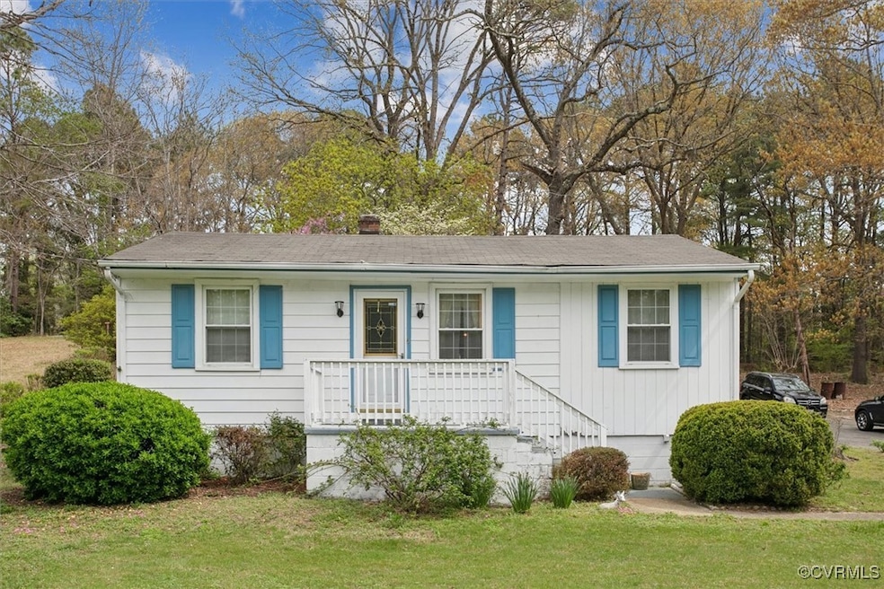 View of front facade with a porch and a front lawn