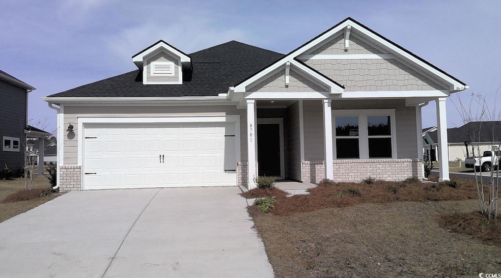 View of front of house with driveway, a shingled r