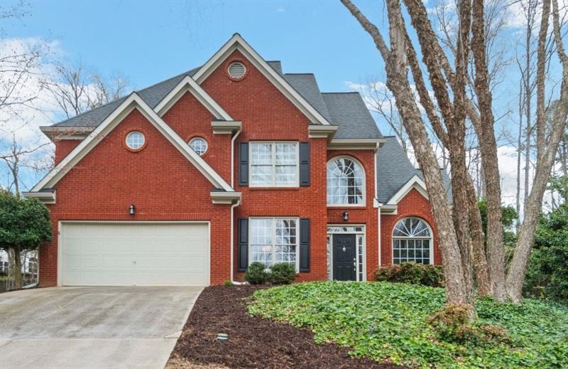 Welcome home to this stately brick-front home in A