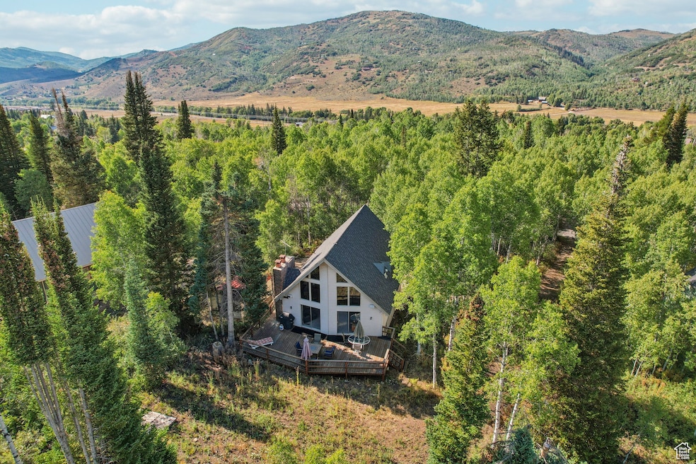 View from above of property with a mountainous background