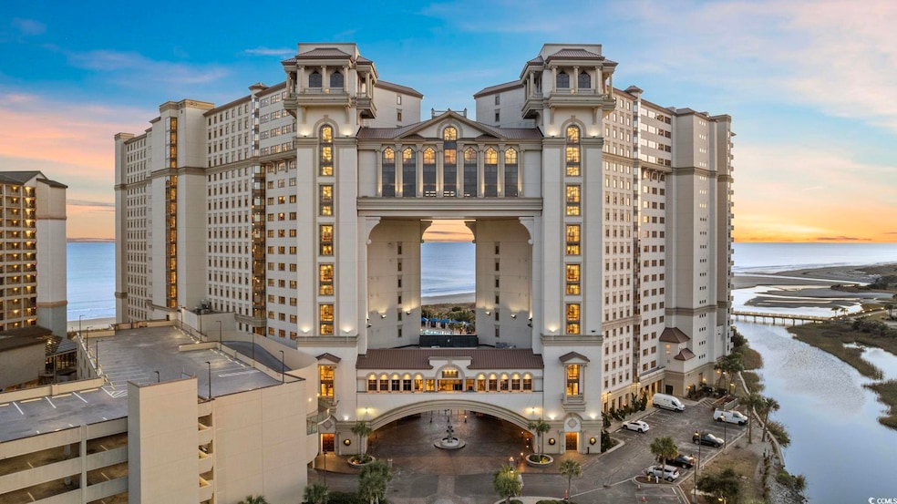 Property at dusk featuring a water view