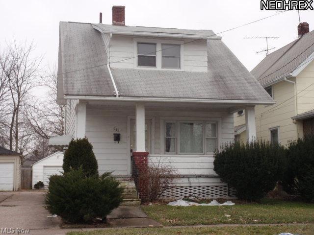 Aluminum sided colonial with 2 car detached garage