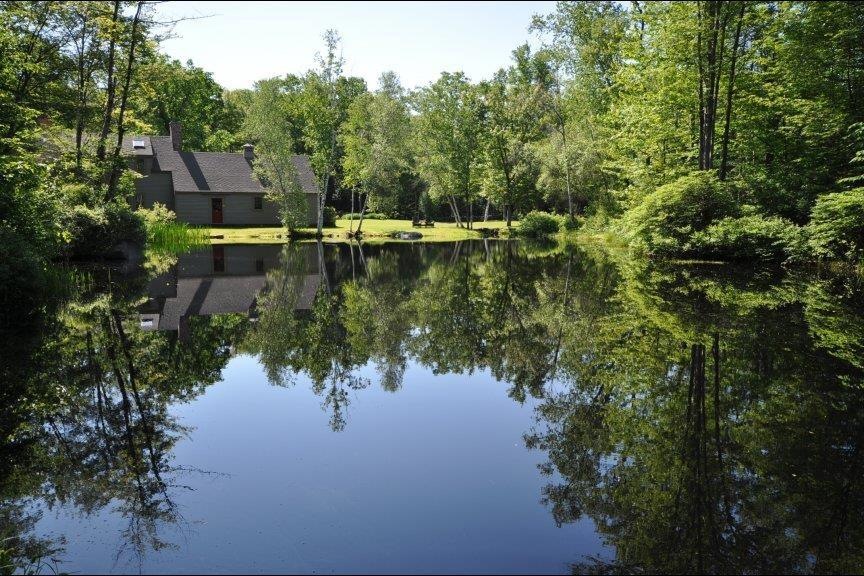 Enjoy lush landscaping around the pond as well as 