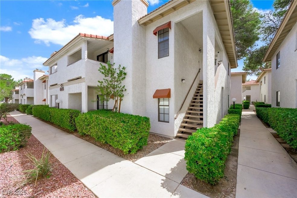 View of property with stairs