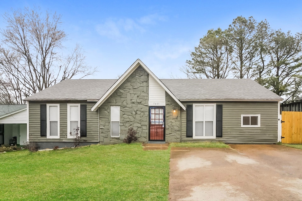 View of front of home with roof with shingles and stone siding