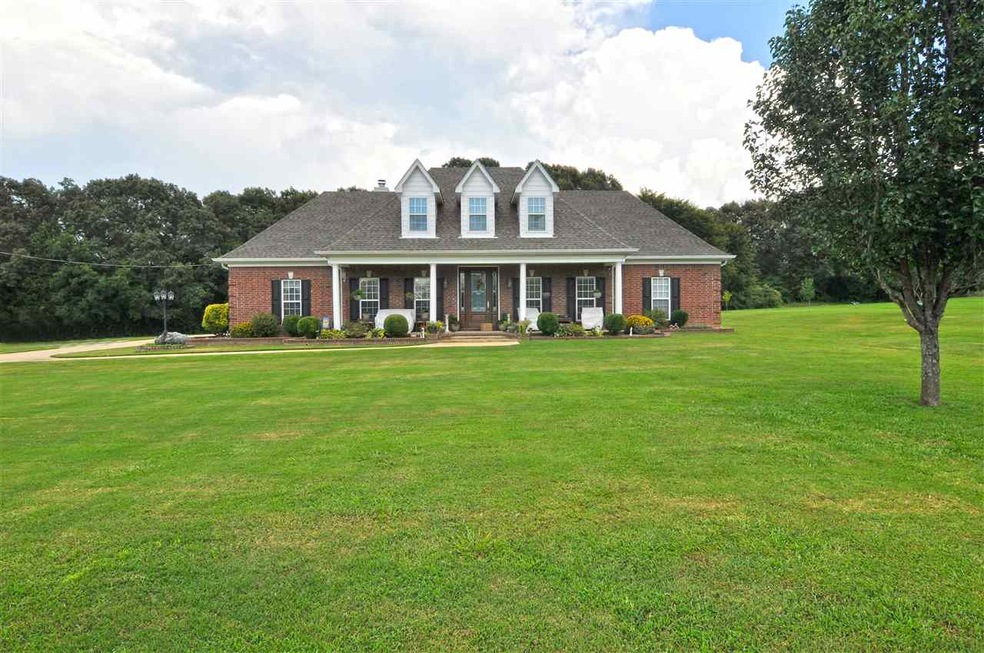 Low maintenance brick exterior with large front po