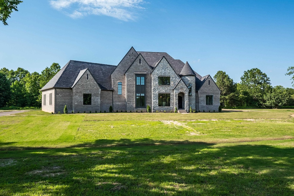 French country style house with a front lawn