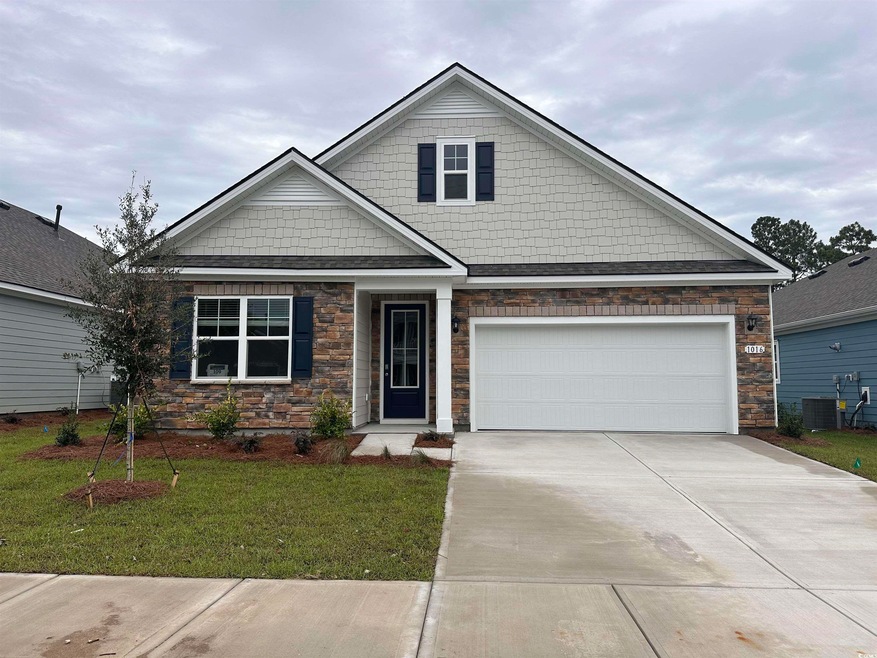 View of front of home with a garage, cooling unit,