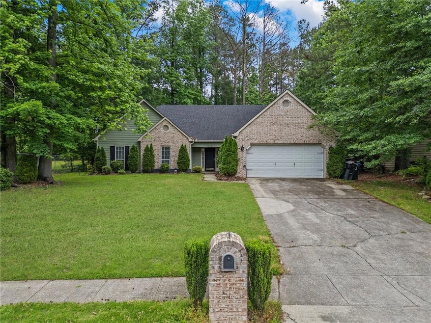 View of front facade featuring an attached garage,