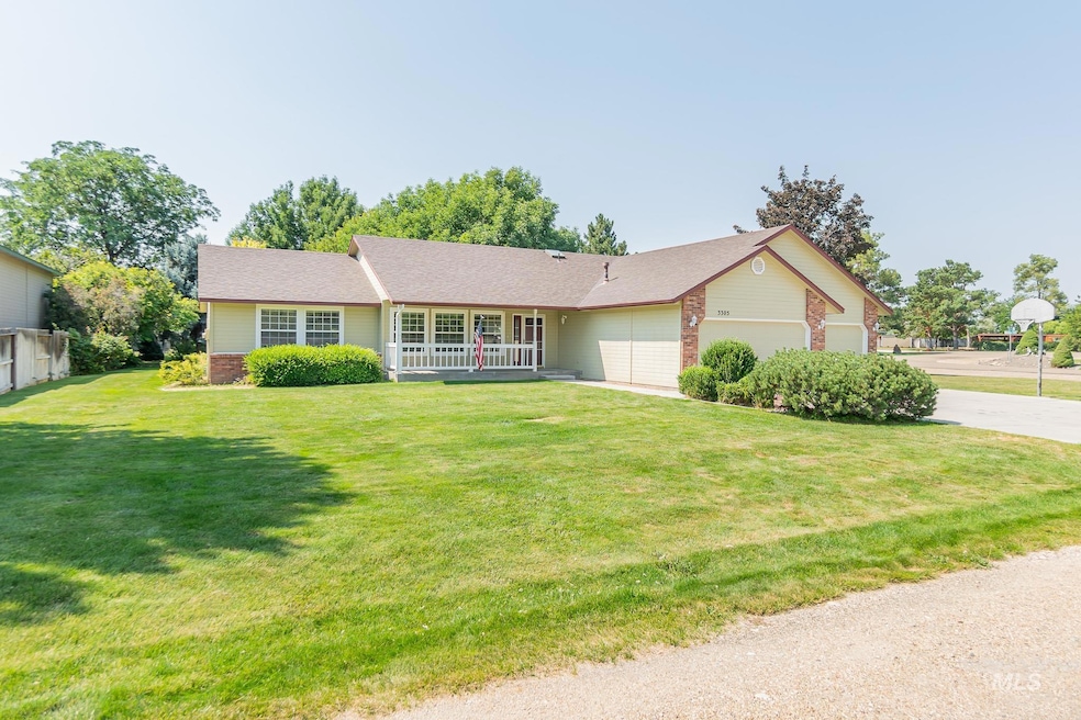 Ranch-style home with an attached garage, a front lawn, driveway, and roof with shingles