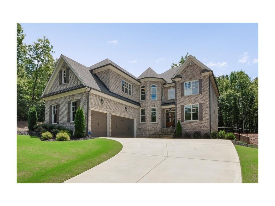 Beautiful 3 sided brick home with 3 car side entry