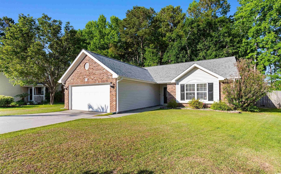 View of front of house with an attached garage, br