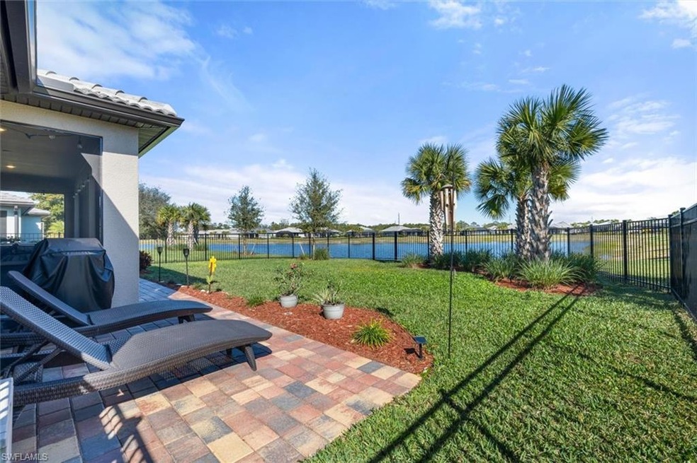 View of yard with a patio area and a water view