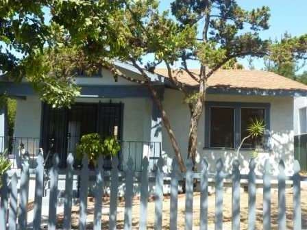 Front of home with nice porch to relax on.