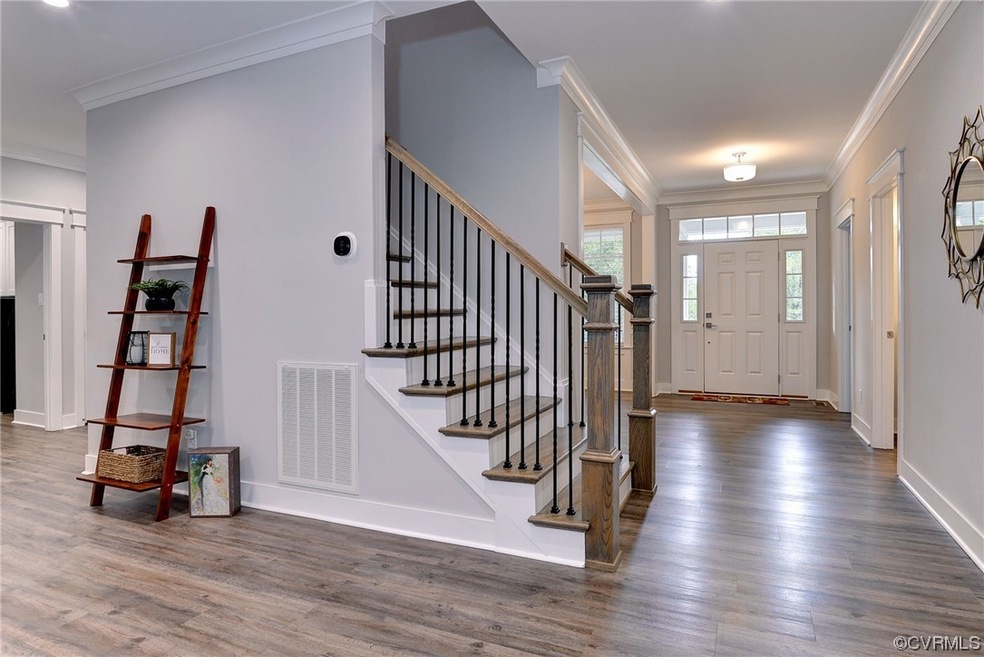 LVP flooring, stained stairs and rails to match floor