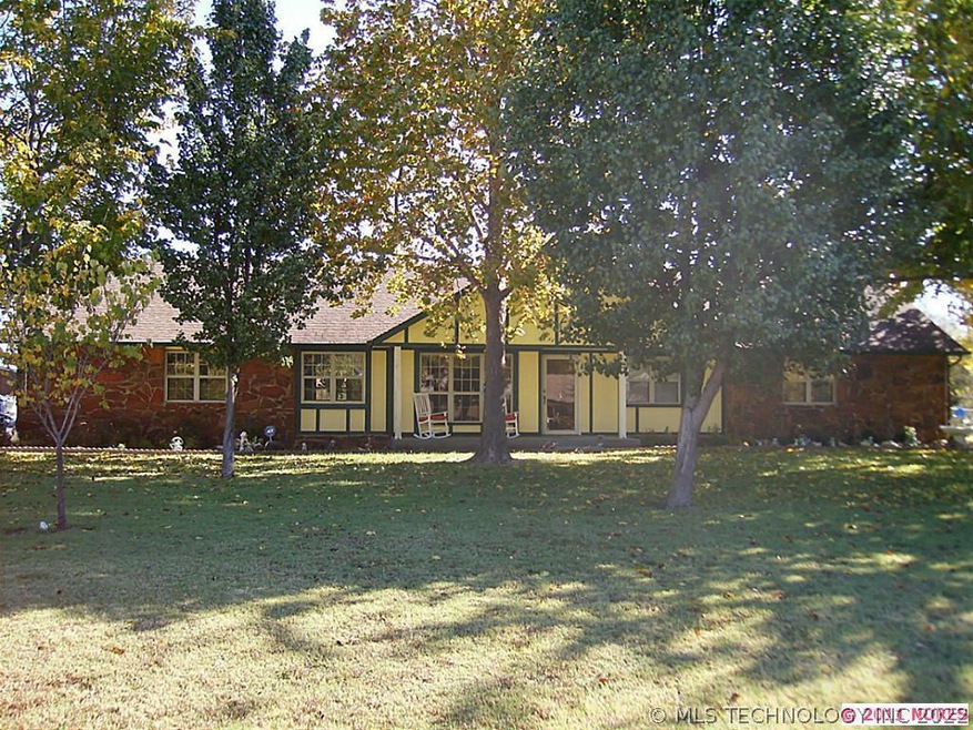Front view of home, Mature trees, manicured yard.F