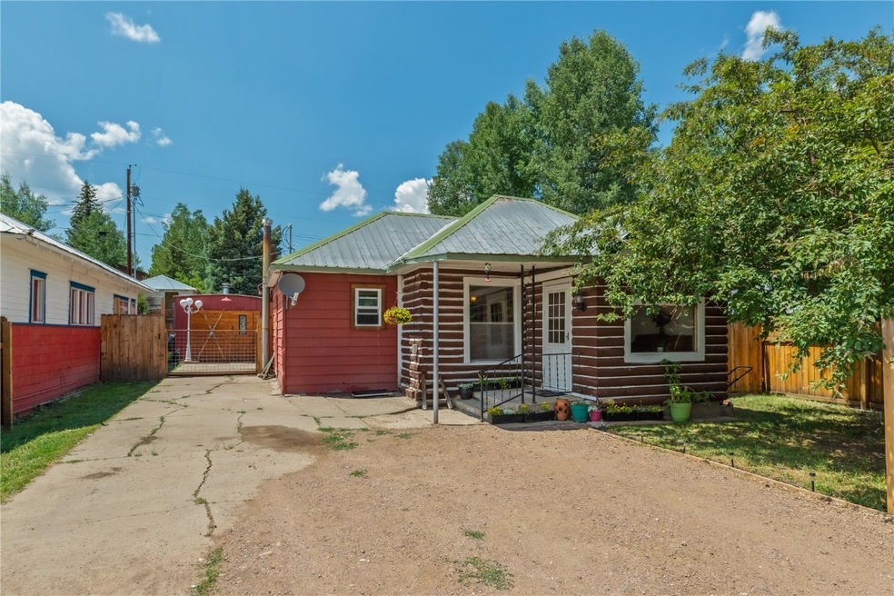 View of front facade featuring a gate, a porch, me