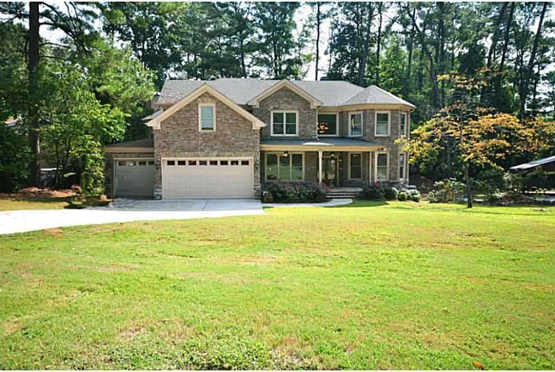 Exterior Front. All Brick 3 car Garage on +.5 acre